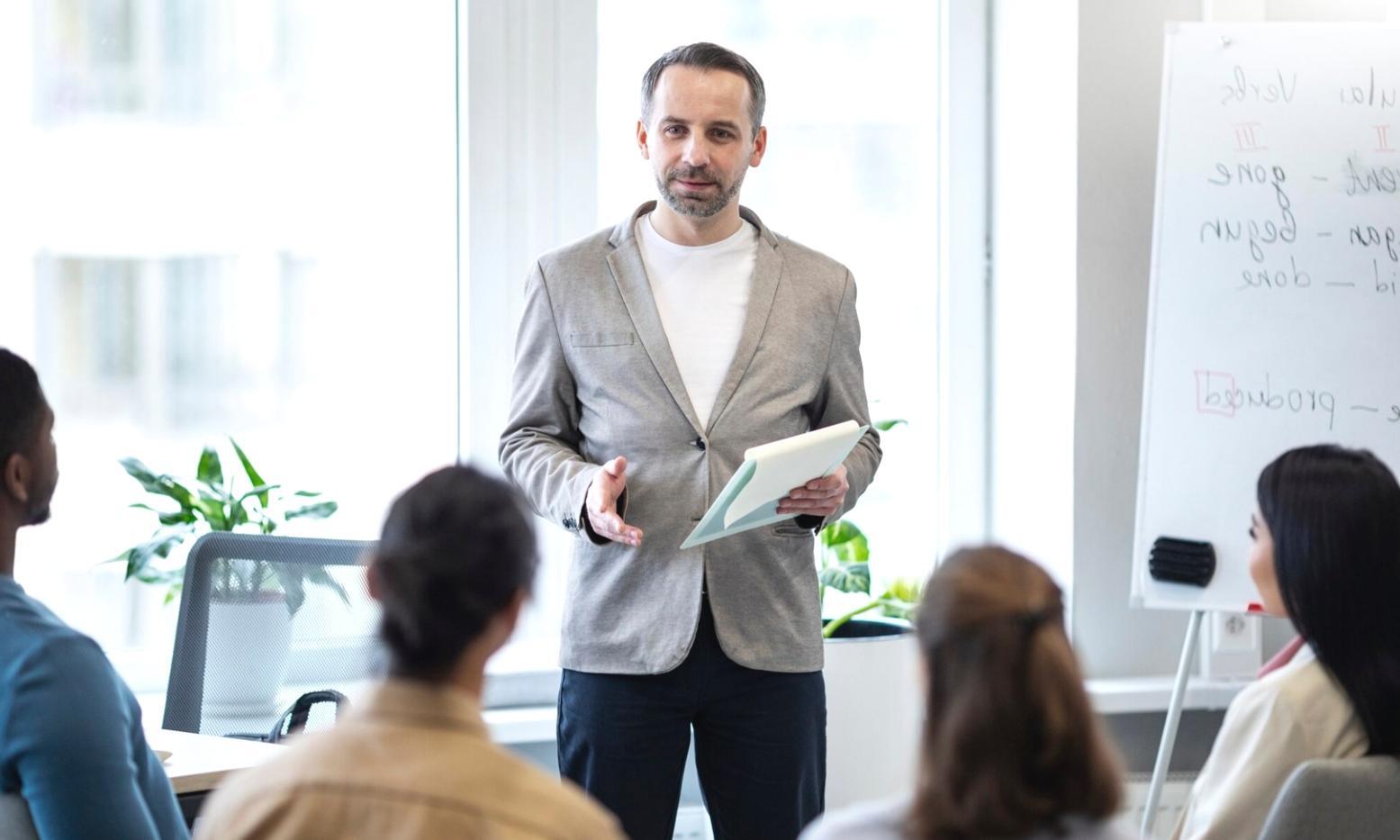 Students working collaboratively on financial planning exercises during a workshop session