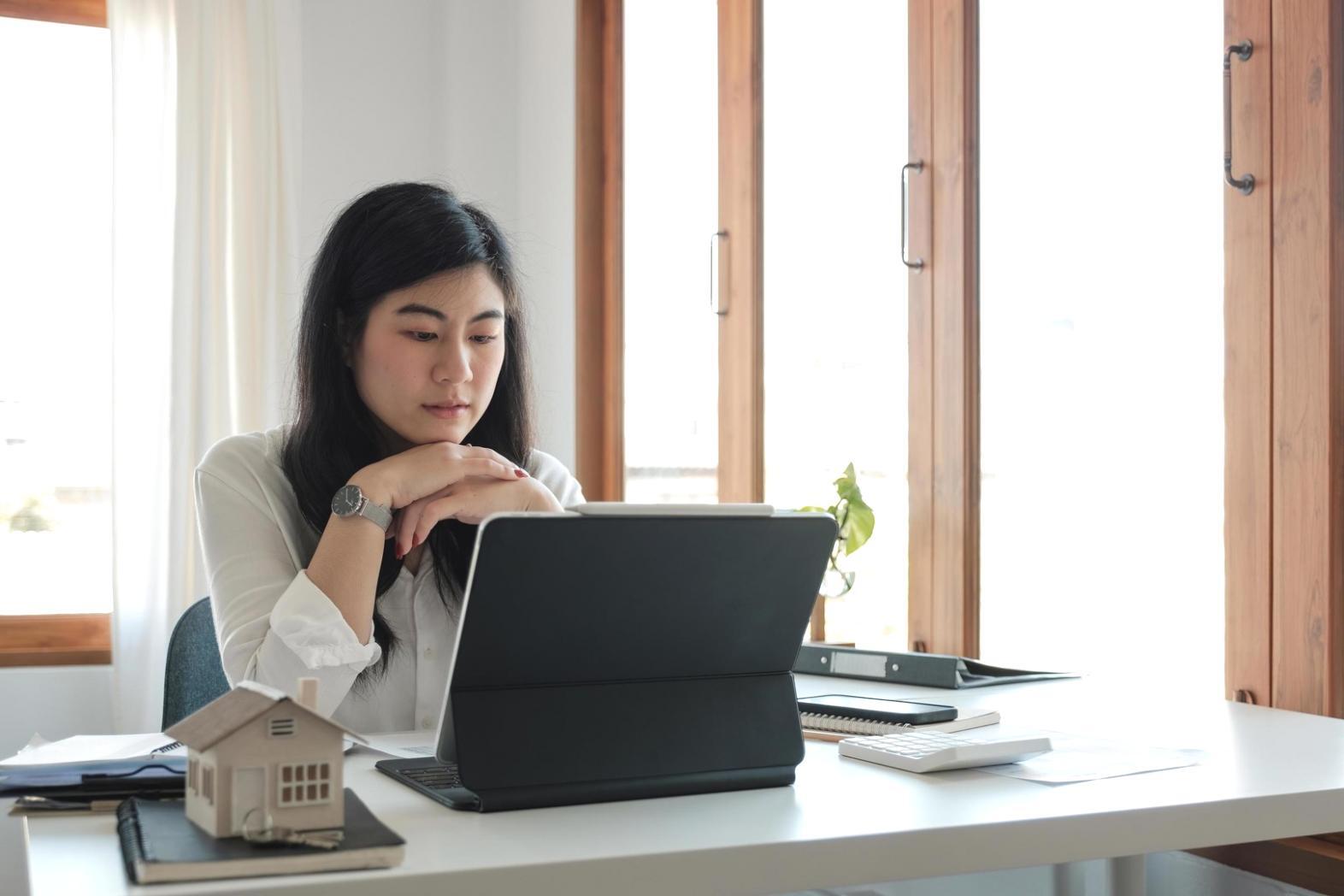 Person analyzing financial charts and seasonal budget patterns